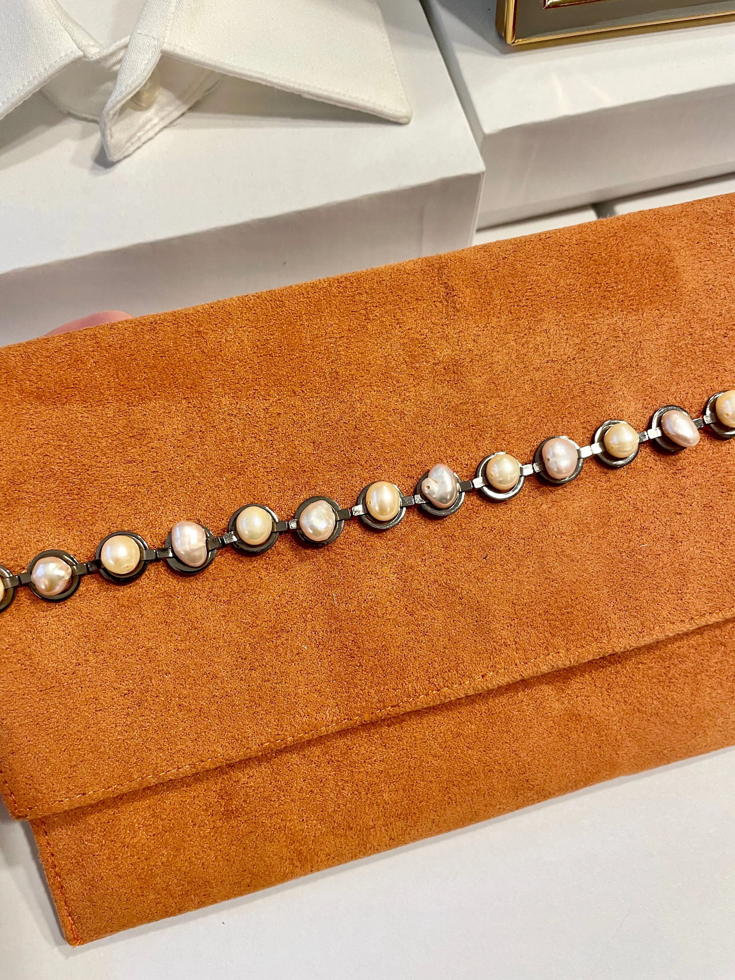 Isn't she Charming... she adores anything with pearls! This one of a kind fresh water pearl clutch, is so chic!